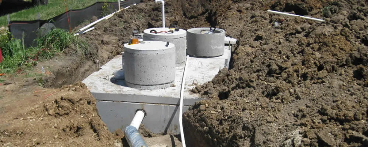 Septic system repair and installation site with tank access ports in West Palm Beach, FL